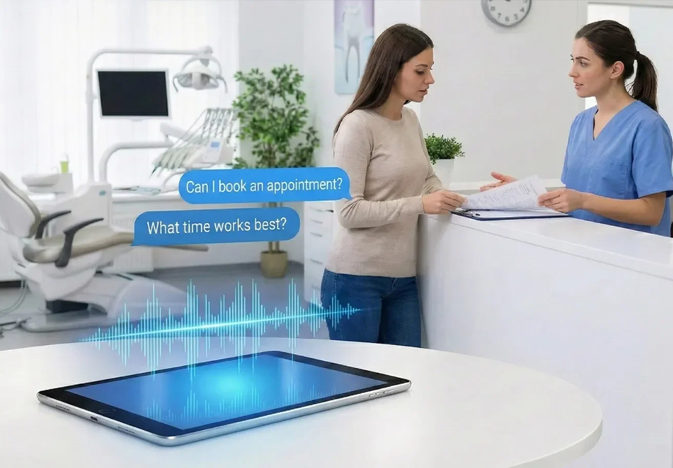 Dental office front desk showing AI software answering phone calls while a human receptionist assists a patient at the desk